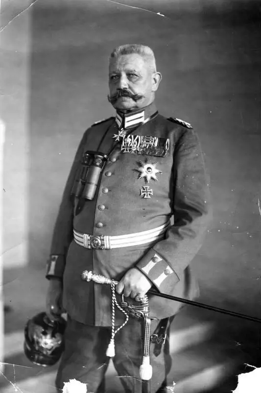 Portrait of an elderly man with a large moustache and close-cropped hair in military uniform.
