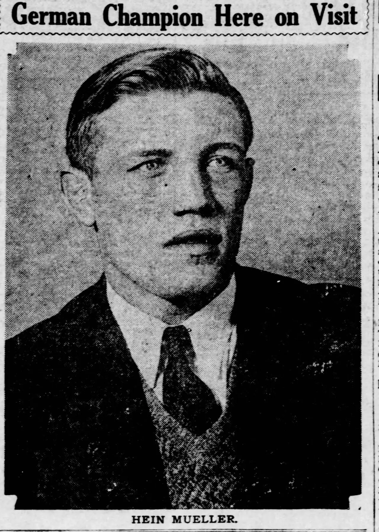 Newspaper portrait of a young man with slicked-back hair in a jacket, tie and sweater, under the headline German Champion Here on Visit